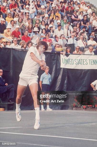 Jimmy Connors returning a volley at a tennis match; circa 1970; New York.