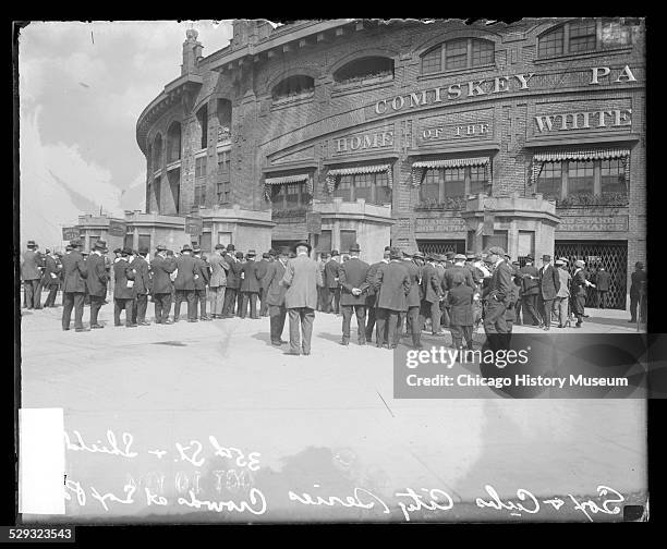 Men standing in lines at ticket booths for the National League's Chicago Cubs and American League's Chicago White Sox City Series games at Comiskey...