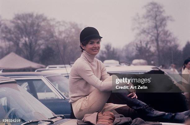 Jacqueline Kennedy Onassis in her riding gear in Peapack NJ. Taken with a telephoto lens; circa 1970; New York.