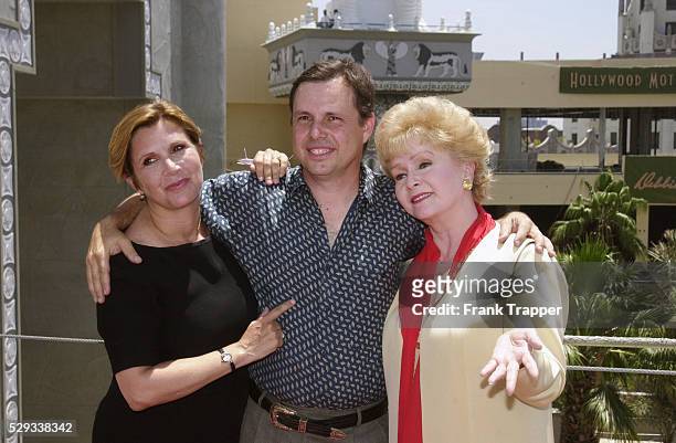 Debbie Reynolds with her children Carrie and Todd Fisher, on the site of the new museum that will house her collection of film costumes.