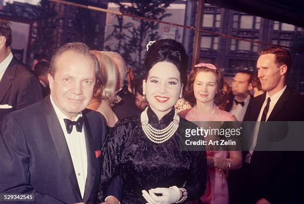 Cindy Adams with her husband Joey Adams going to a formal event; circa 1970; New York.