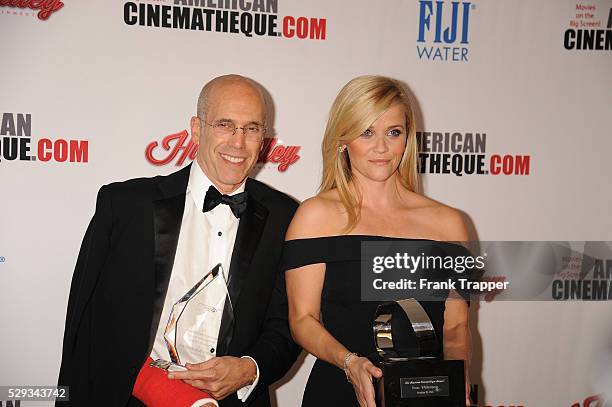 Honorees, producer Jeffrey Katzenberg and actress Reese Witherspoon pose with their 29th American Cinematheque Award, at the Hyatt Regency Century...