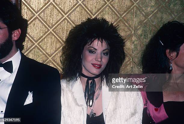Joan Jett at a formal event wearing a white jacket; circa 1970; New York.