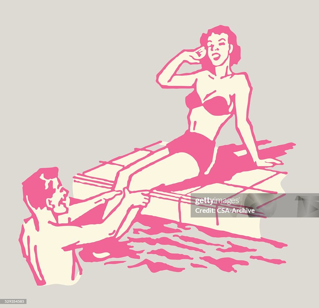 Man Talking to Woman at Swimming Pool