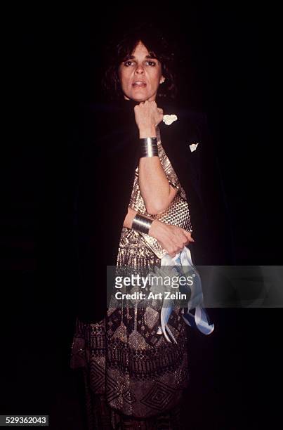 Ali MacGraw wearing a print lame dress; circa 1970; New York.