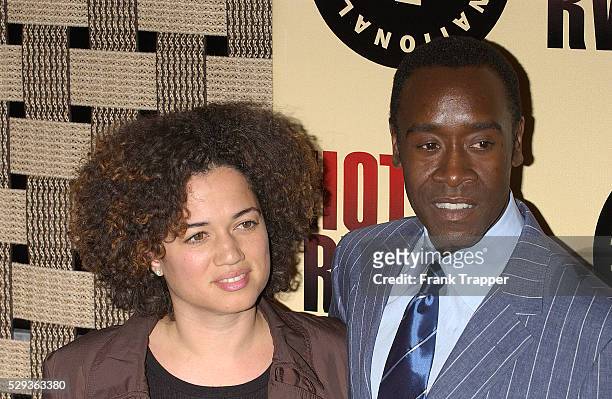 Co-star Don Cheadle and his wife arrive at the premiere of "Hotel Rwanda."