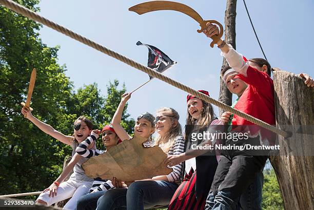group of children playing on a pirate ship in adventure playground, bavaria, germany - fake of indian girls stock pictures, royalty-free photos & images