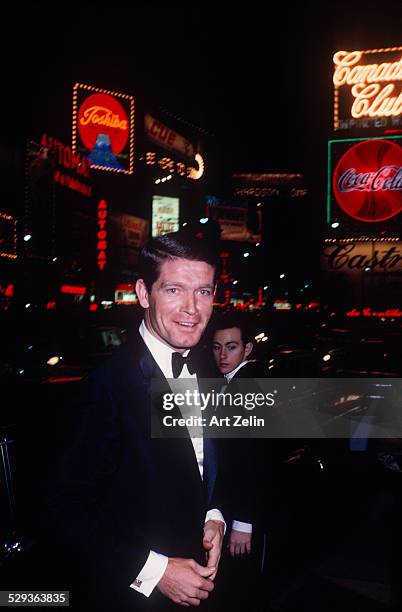 Stephen Boyd with a limousine in the background; circa 1970; New York.