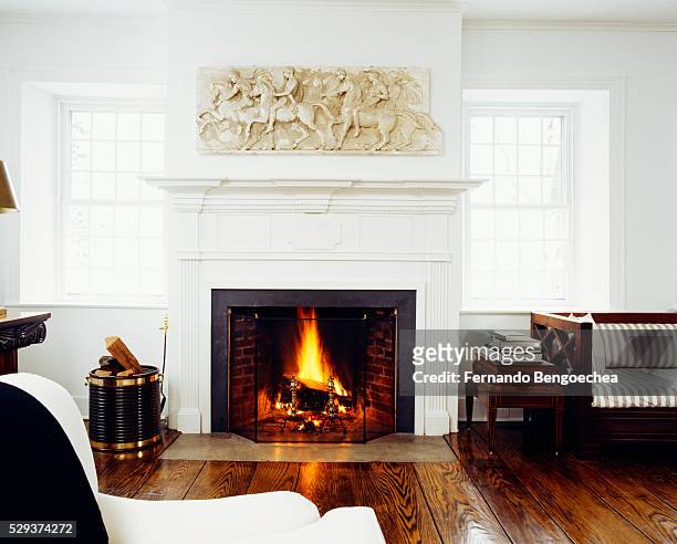 front view of fire lit in the fireplace - fireplace imagens e fotografias de stock