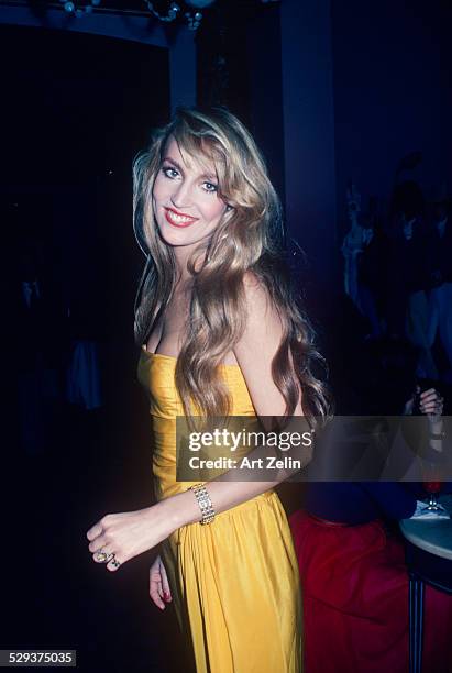 Jerry Hall in a yellow strapless dress; circa 1978; New York.