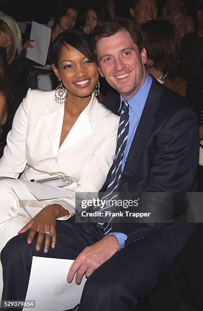 Garcelle Beauvais-Nilon and husband arrive at the Richard Tyler Spring 2004 fashion show.