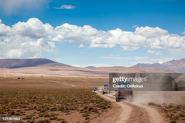 sports utility vehicle drinving in the bolivian altiplano - 4x4 stock pictures, royalty-free photos & images