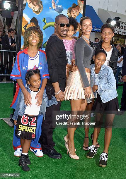 Eddie Murphy and his wife Nicole arrive with their family to the Los Angeles premiere of the animated fantasy motion picture "Shrek 2" held at Mann...