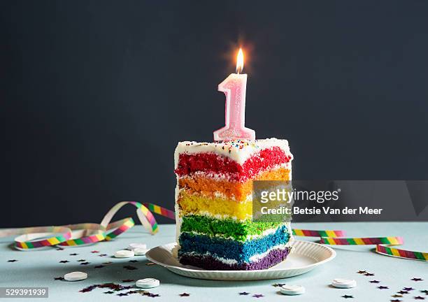 still life of cake with candle number 1 on top. - eerste verjaardag stockfoto's en -beelden