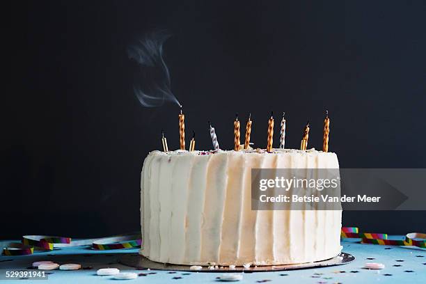 birthday cake with blown out candles, still life. - birthday candle on black stock pictures, royalty-free photos & images