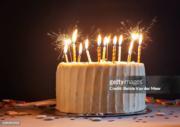 birthday cake with candles and sparklers. - birthday cake stock pictures, royalty-free photos & images