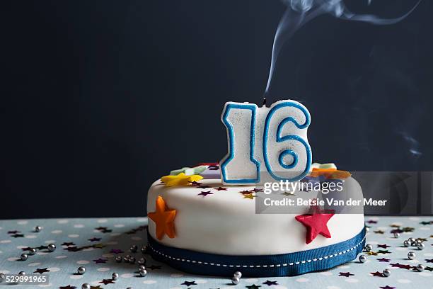 still life of birthday cake with number 16 candle. - birthday candle on black stock pictures, royalty-free photos & images