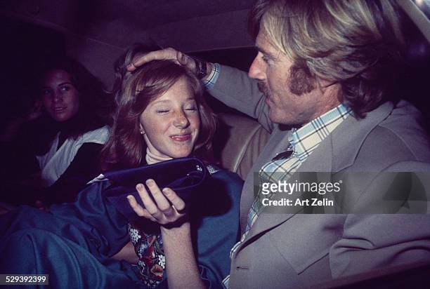 Robert Redford and his daughter Amy, in taxi near Brooklyn Academy of Music, he picked her up after her event; circa 1970; New York.