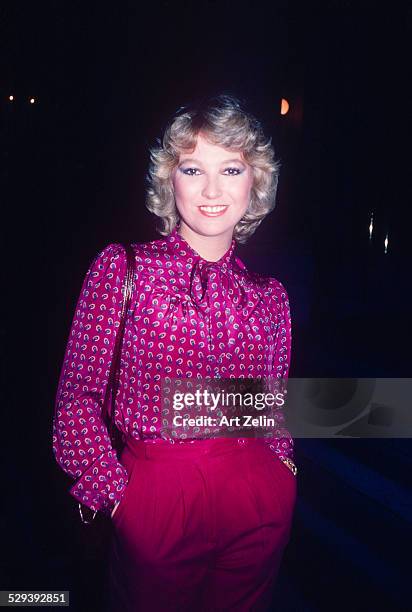 Tanya Tucker wearing a fuchsia paisley blouse; circa 1970; New York.