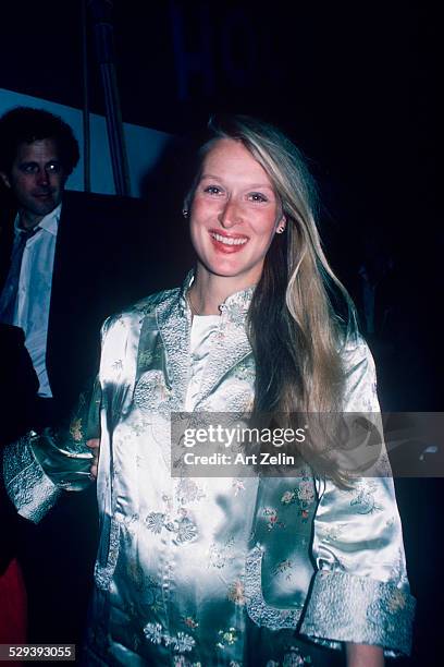 Meryl Streep wearing a gray brocade dress she is pregnant; circa 1970; New York.