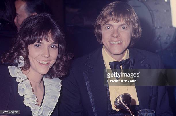 Richard Carpenter with his sister Karen Carpenter holding a Grammy Award; circa 1970; New York.