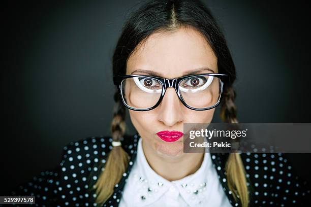 nervous stressed anxious woman with glasses - geek girl stock pictures, royalty-free photos & images