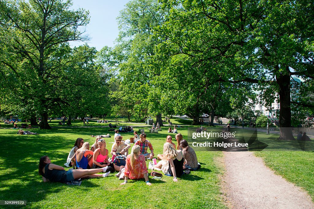 Young people relax in Kungsparke park
