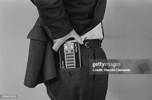 Man displays a pocket size radio at the Radio Show exhibition, 26th August 1958.