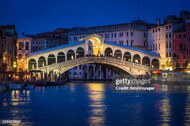 venice rialto bridge and grand canal palazzo illuminated night italy - rialto bridge stock pictures, royalty-free photos & images