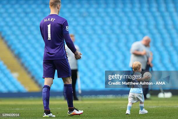 Joe Hart of Manchester City with his son, Harlow Hart after the Barclays Premier League match between Manchester City and Arsenal at the Ethiad...