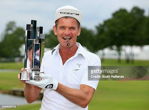 Jesper Parnevik of Sweden poses with the winner's trophy after his four-stroke victory at the Insperity Invitational at The Woodlands Country Club on...