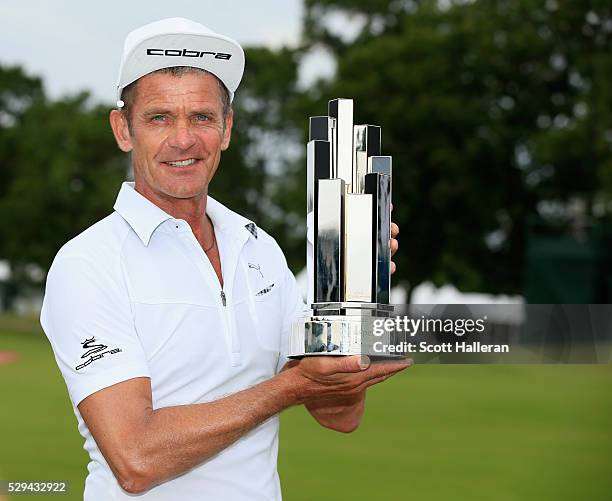 Jesper Parnevik of Sweden poses with the winner's trophy after his four-stroke victory at the Insperity Invitational at The Woodlands Country Club on...