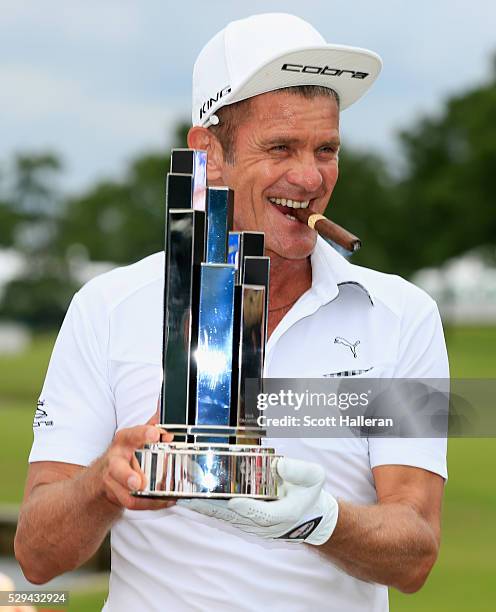 Jesper Parnevik of Sweden poses with the winner's trophy after his four-stroke victory at the Insperity Invitational at The Woodlands Country Club on...