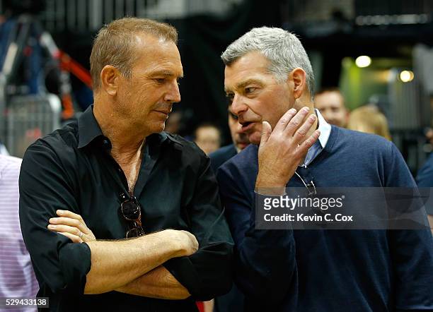 Antony Ressler, principal owner of the Atlanta Hawks, converses with actor Kevin Costner prior to Game Four of the Eastern Conference Semifinals...