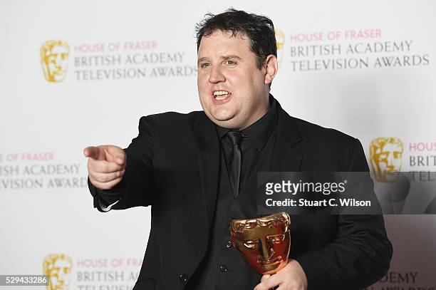 Peter Kay, winner of the Male Performance in a Comedy Programme for 'Peter Kay's Car Share' poses in the Winners room at the House Of Fraser British...