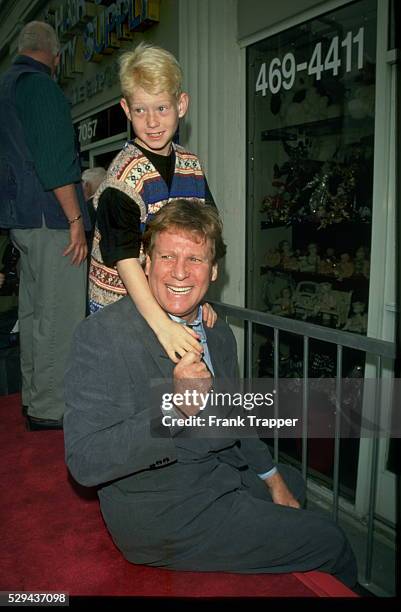 Actor Ryan O'Neal and sone Redmond.