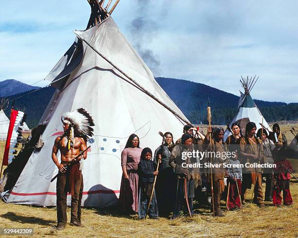 Mexican actor Jorge Rivero as Cheyenne chief Spotted Wolf, with cast members playing Native Americans, in the revisionist western, 'Soldier Blue',...