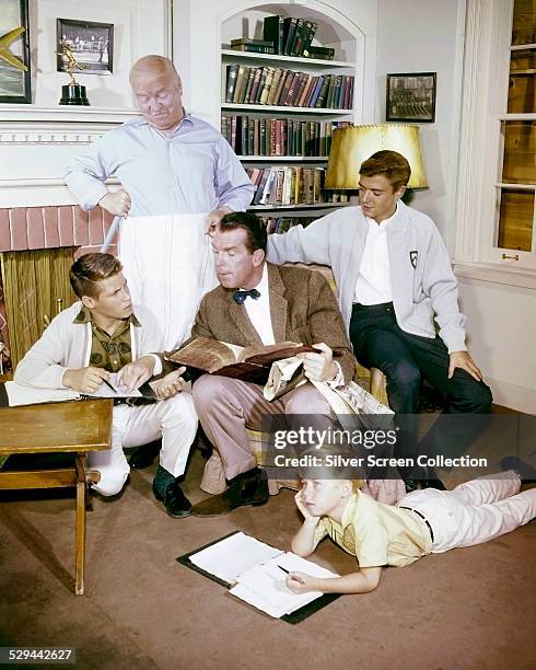 Some of the cast of the American TV sitcom 'My Three Sons', circa 1963. Left to right: Don Grady , William Frawley , Fred MacMurray , Stanley...