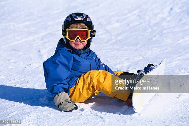 a little boy on a snowboard sweden - sweden snowboarding stock pictures, royalty-free photos & images