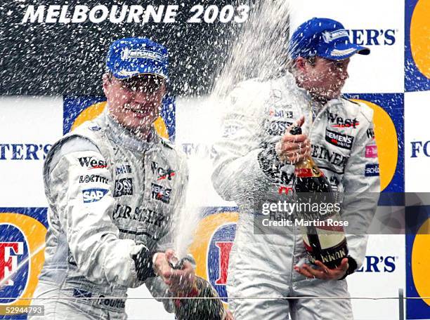 Von Australien 2003, Melbourne; Champagnerdusche: Sieger David COULTHARD/SCO, 3. Platz fuer Kimi RAEIKKOENEN/FIN - McLaren Mercedes -