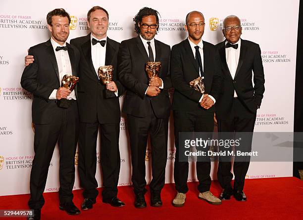 Sir Trevor McDonald poses with David Olusoga and fellow winners of the Specialist Factual award for "Britain's Forgotten Slave Owners" in the winners...
