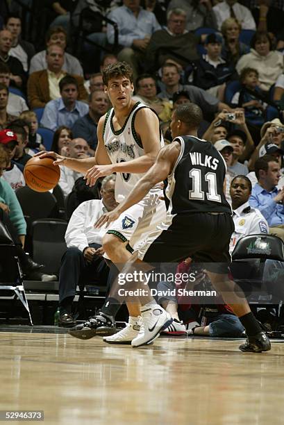 Wally Szczerbiak of the Minnesota Timberwolves is defended by Mike Wilks of the San Antonio Spurs during the game at Target Center on April 20, 2005...