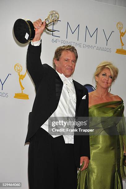 Actor Tom Berenger, winner Outstanding Supporting Actor in a Miniseries or a Movie for Hatfields & McCoys pose with his wife at the 64th Annual Emmy...