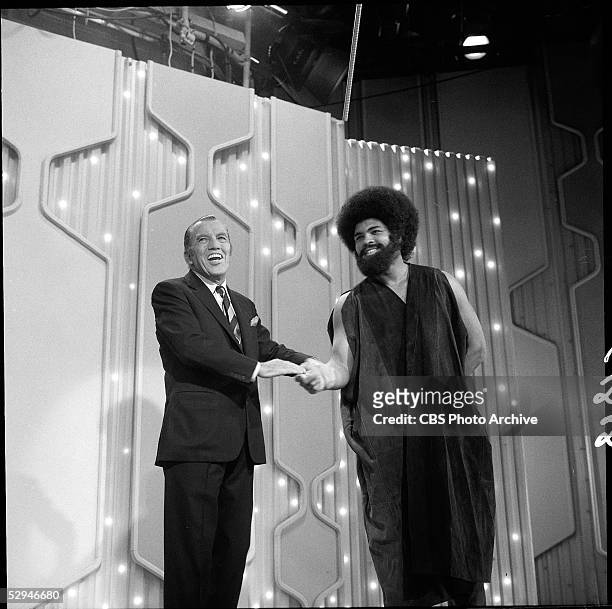 American boxer and sometime actor Muhammad Ali shakes hands with American television empresario Ed Sullivan on an episode of Sullivan's 'Toast of the...