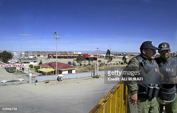 Policemen guard a plant of liquified gas at El Alto, 12 km from La Paz during a national protest in demand of the nationalization of the country's...