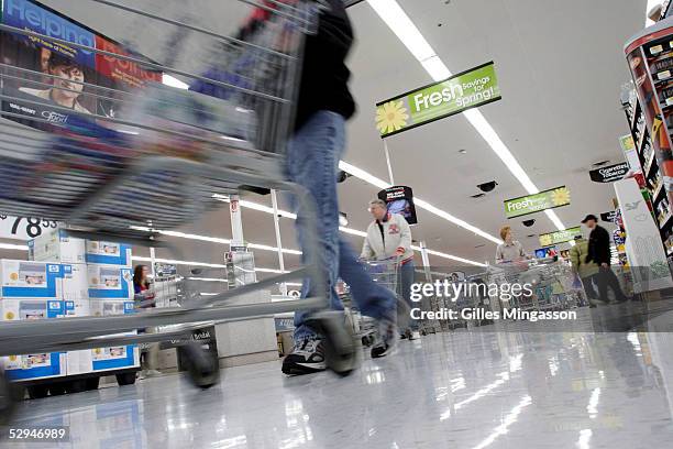 Shoppers look for merchandise at a Wal-Mart store, March 14, 2005 in Bentonville, Arkansas. Based in the small town of Bentonville, Arkansas , with...