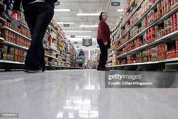 Shoppers look for merchandise at a Wal-Mart store, March 14, 2005 in Bentonville, Arkansas. Based in the small town of Bentonville, Arkansas , with...