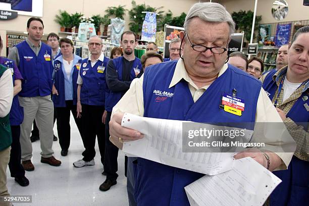 The manager of a Wal-Mart store reads the previous day sales and announces the company's latest stock value to the store's employees, a daily routine...