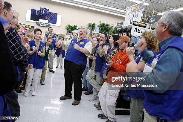The manager of a Wal-Mart store leads his employees through the Wal-Mart cheer, a daily routine at all of Wal-Mart's 5,307 stores, March 16, 2005 in...
