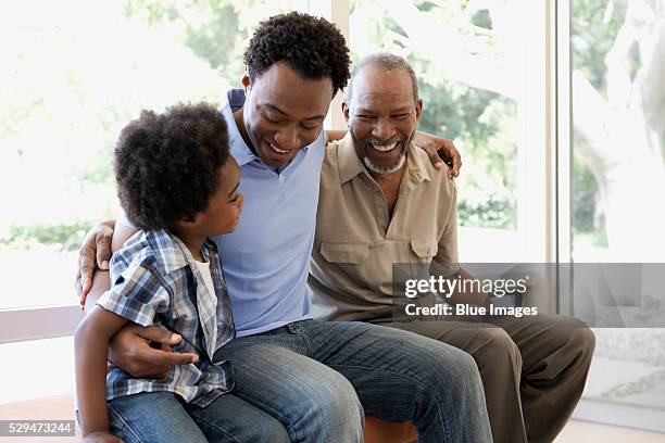 smiling father, son and grandfather - familia multigeneracional fotografías e imágenes de stock